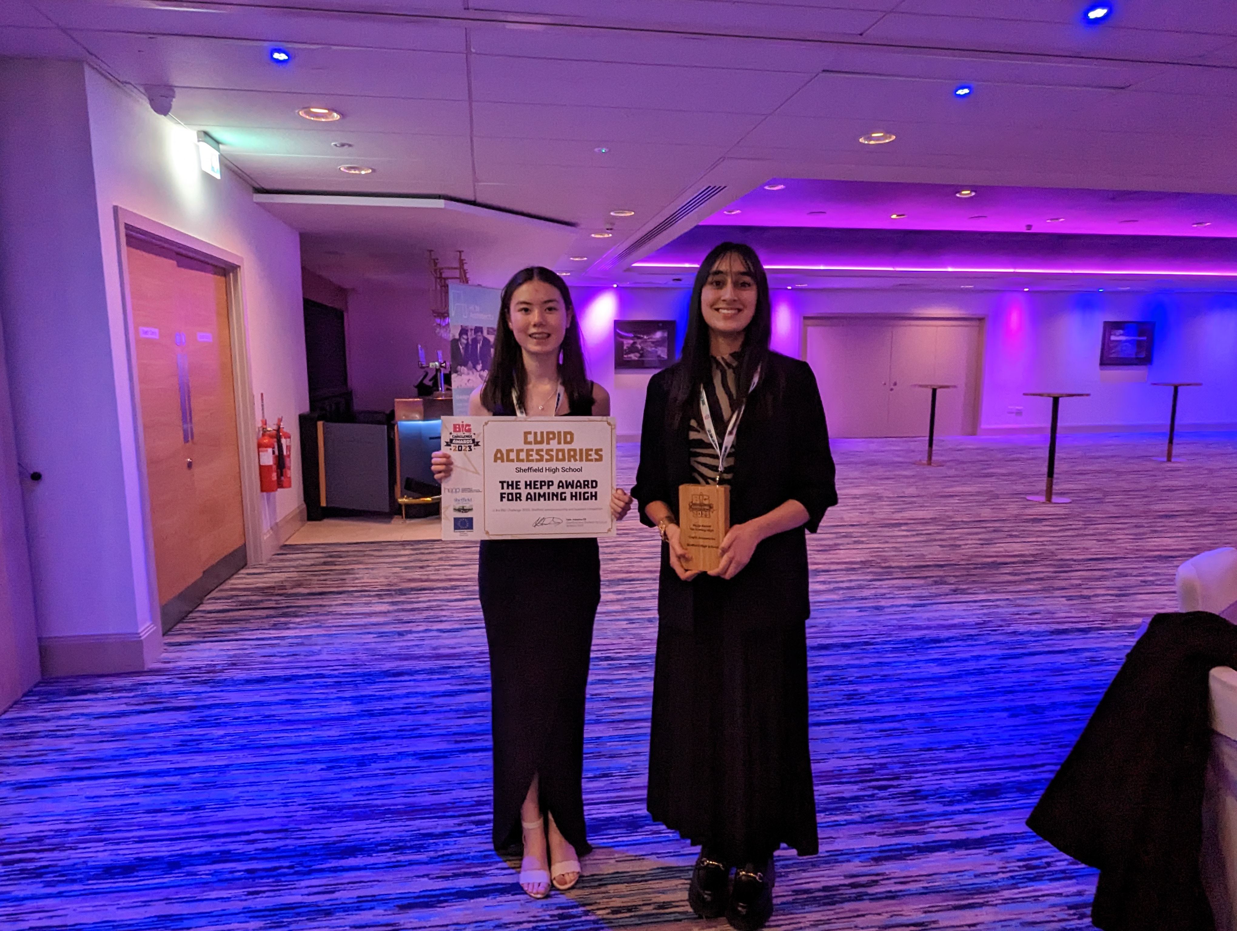 Cecillia and Yasmeen show off their BiG Challenge award.